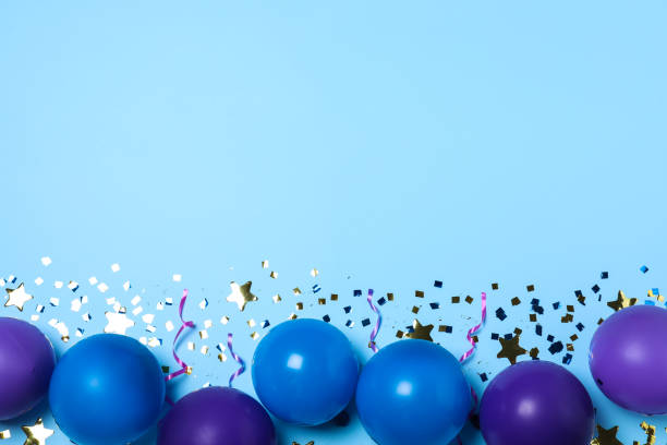 istock Many balloons and confetti on light blue background, flat lay with space for text. Birthday decor 1331815172