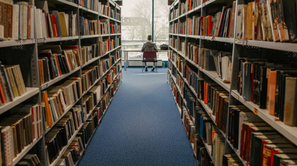 istock Various books on shelves in library 1331816599