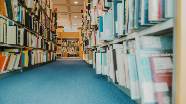 istock Books on shelves in library 1331816600