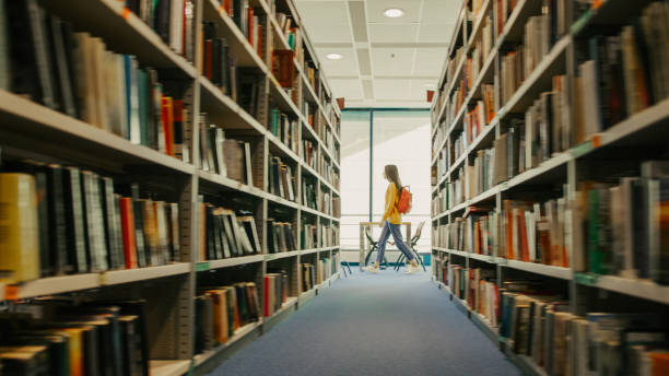 Various books on shelves in library