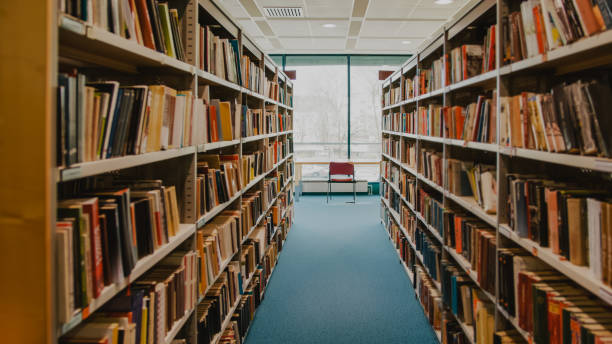 istock Books on shelves in library 1331816650