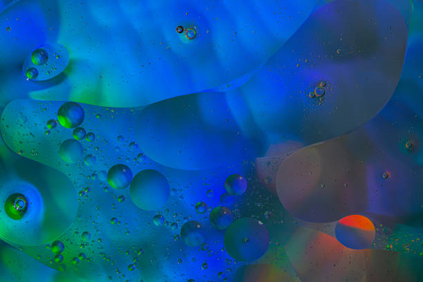 istock Close up image of mixed oil with water 1331818590