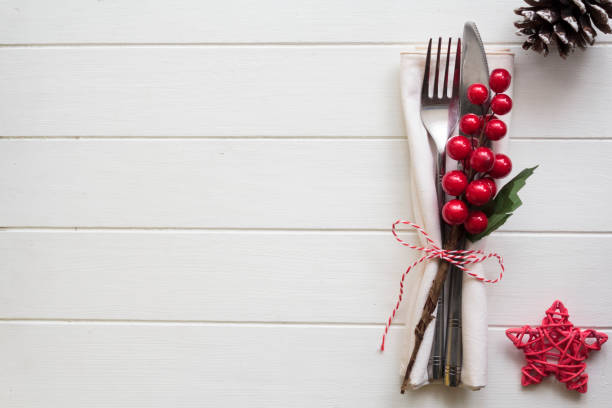 istock Christmas table setting on white wooden table with copy space 1331821879