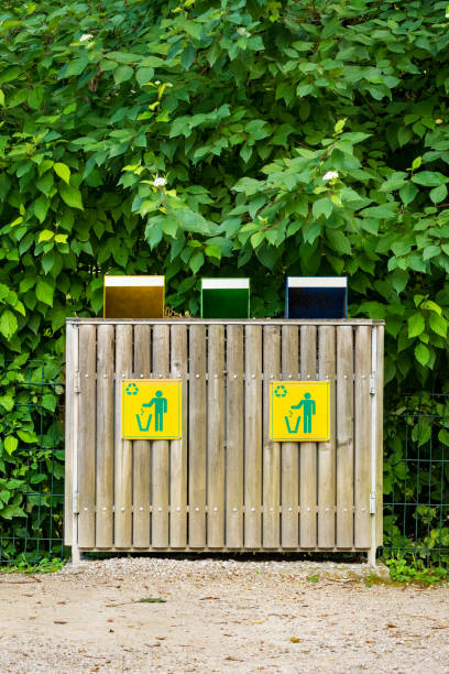 istock Recycling bins next to park footpath 1331821957