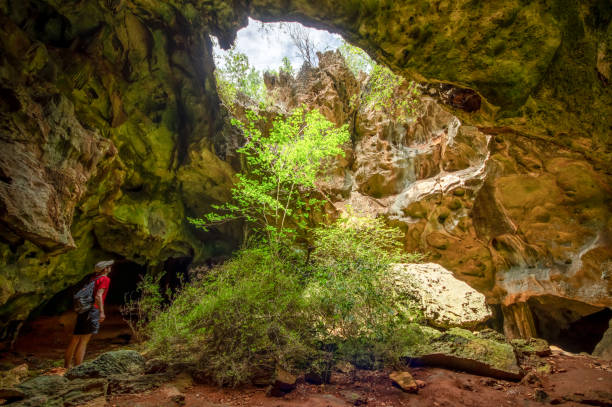 istock hiker inside a natural cave in Guajimico, Cuba 1331822045
