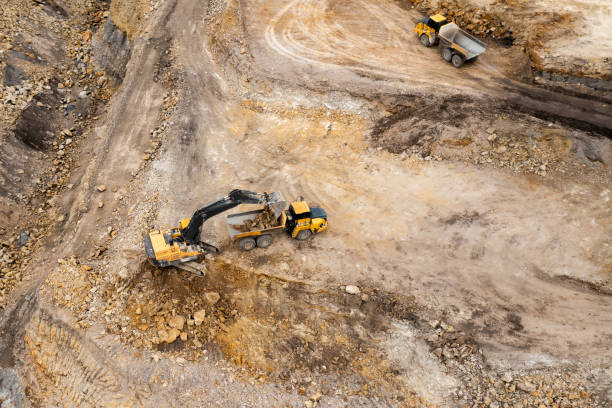 istock Aerial view of excavators digging ground. Opencast mining quarry. 1331824519
