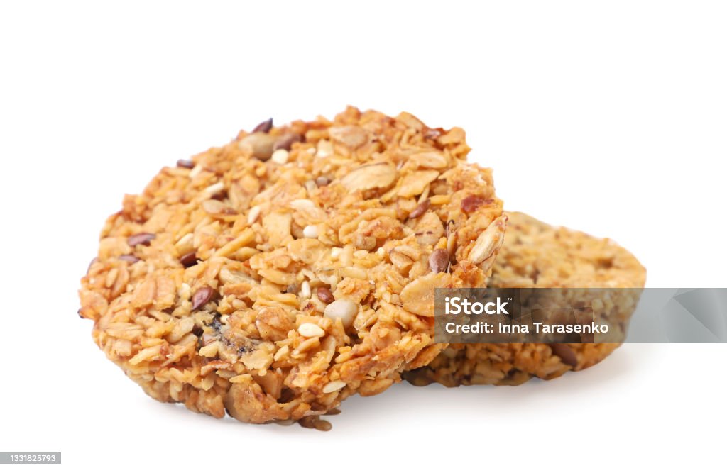 Two granola cookies on a white background. Isolated Two granola cookies close-up on a white background. Isolated Cookie Stock Photo