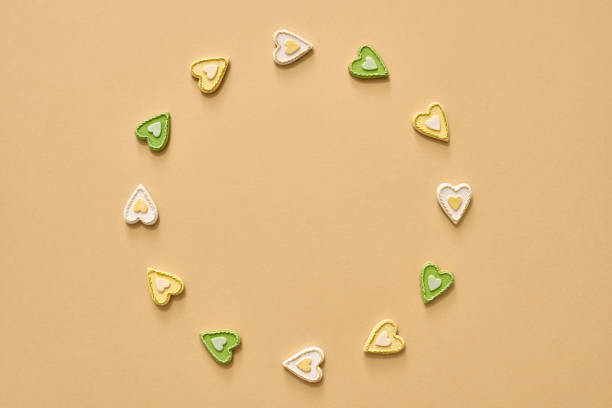 istock Pastel background with green and yellow hearts 1331826261