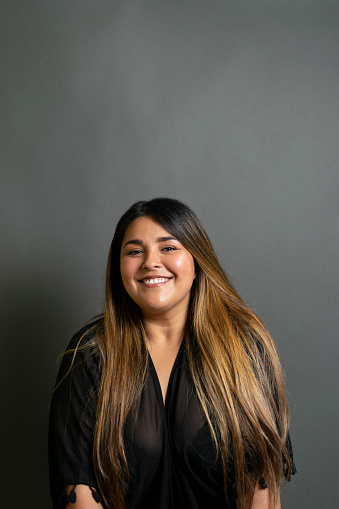 portrait of beautiful and happy latin woman smiling. mexican chubby