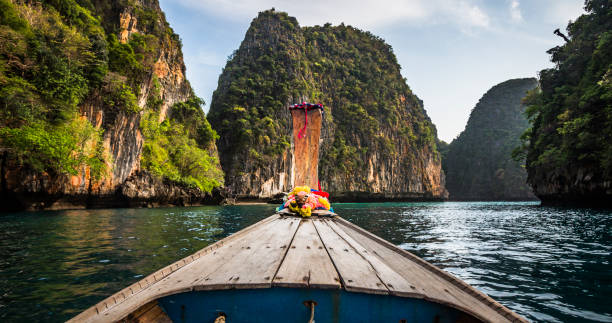 Boat Trip in Tropical Lagoon - Thailand POV footage of boat trip through a tropical lagoon surrounded by steep limestone rocks. Kho Phi Phi Lee Island - Thailand phi phi islands stock pictures, royalty-free photos & images