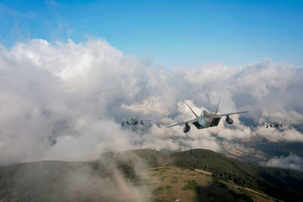 istock Jet fighters flying over the clouds. 1331830634