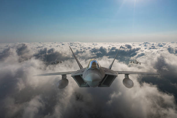 istock Jet fighters flying over the clouds. 1331830854