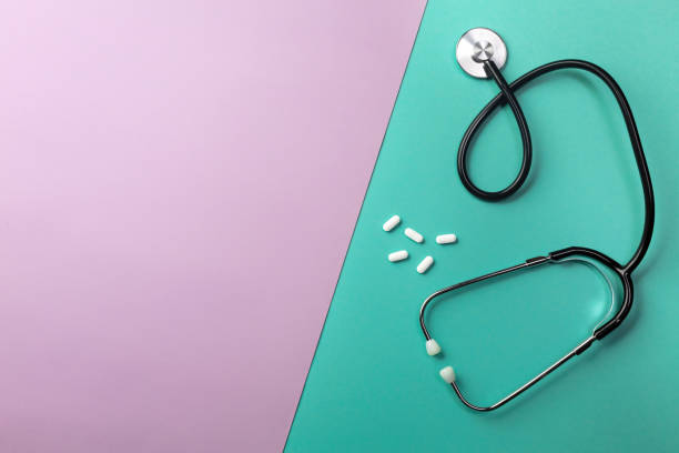 istock Stethoscope in doctors desk with pills 1331830893