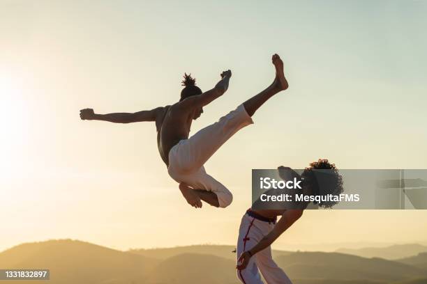 Capoeira Fighter Jumping Kicking Stock Photo - Download Image Now - Capoeira, Brazil, Brazilian Culture