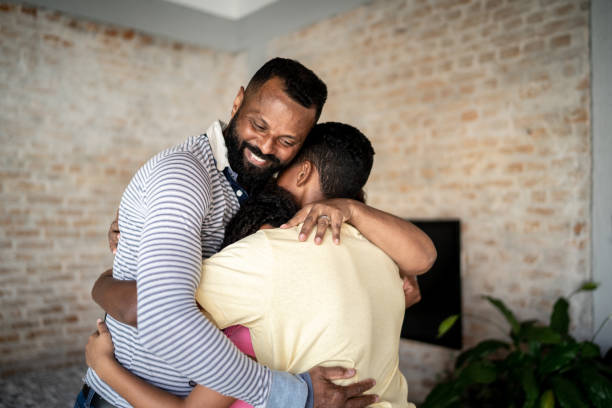 istock Family embracing at home 1331834730