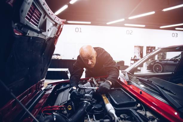 istock Man repairing car engine with his tools. 1331835893