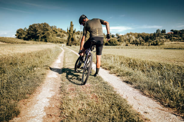 istock biker side view on the countryside with tattoo 1331838037
