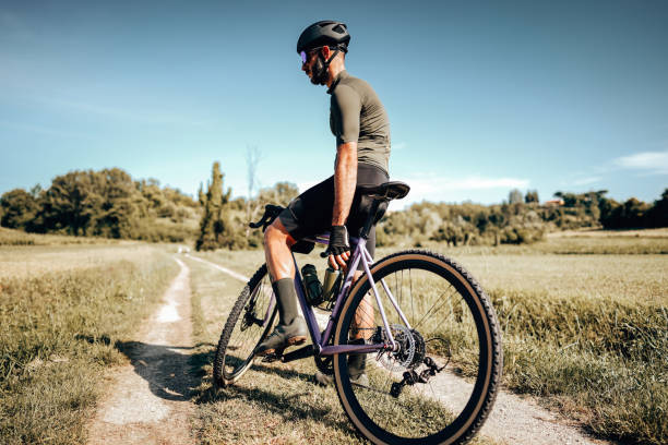 istock biker side view on the countryside with tattoo 1331838064