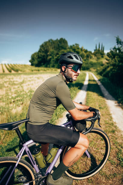 istock biker side view on the countryside with tattoo 1331838603