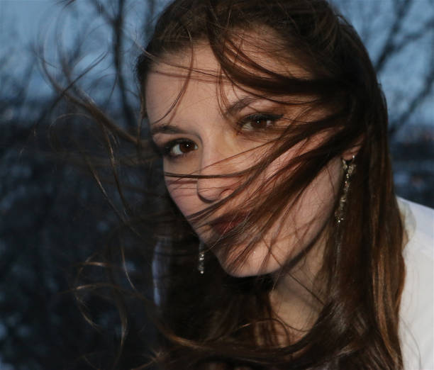 istock Beautiful brunette on windy day 1331838636
