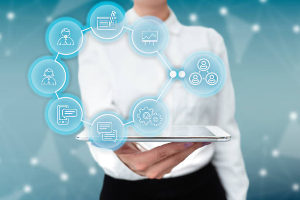 istock Lady In Uniform Standing Holding Tablet In Hand Presenting Virtual Modern Technology. Business Woman Carrying Tab Pointing For New Futuristic Tech. 1331838721