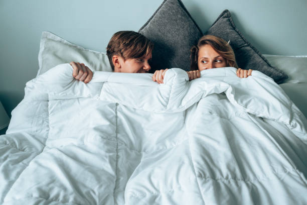 tired couple after they had sex stock photo