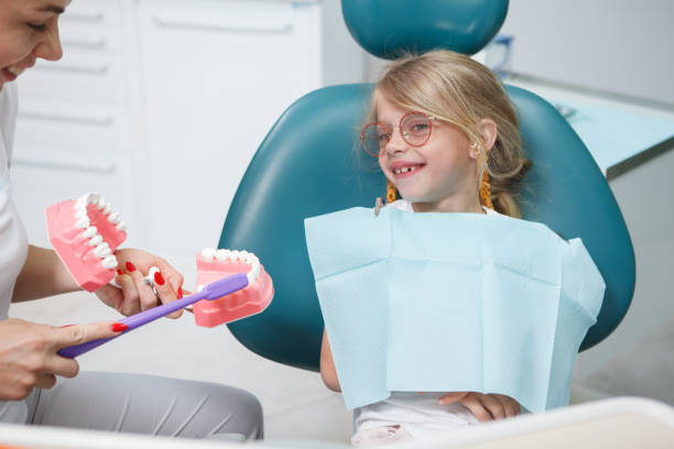 istock Little Girl at dentists office 1331840784