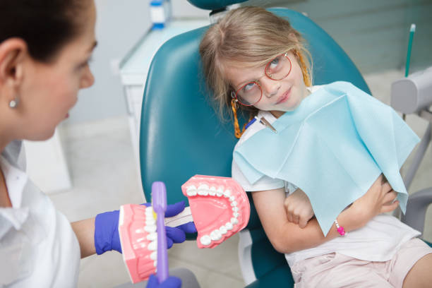 istock Little Girl at dentists office 1331840817