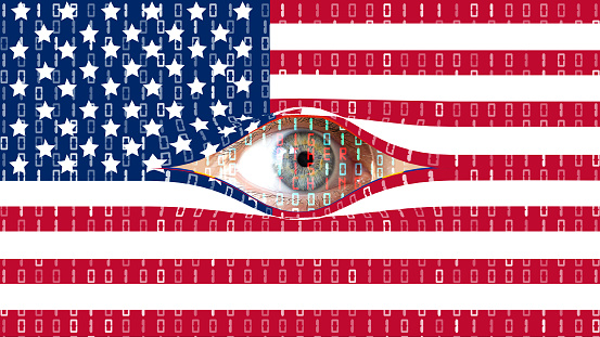 The eyes of Big Brother is watching secretly from behind the digital curtain of the USA flag
