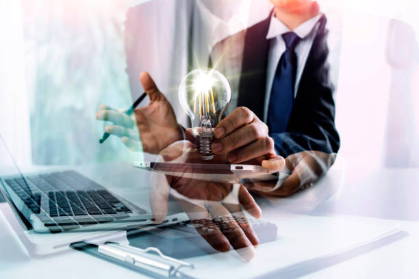 istock Business people using tablets And using his finger to touch the screen With a business graph showing up in a virtual screen.New startup ideas and business growth concept. 1331844824