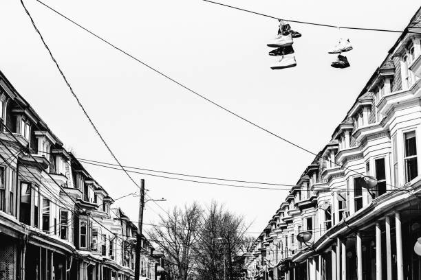 Sneakers hanging on the power lines - Allentown, PA Sneakers hanging on the power lines - Allentown, Pennsylvania allentown pennsylvania stock pictures, royalty-free photos & images