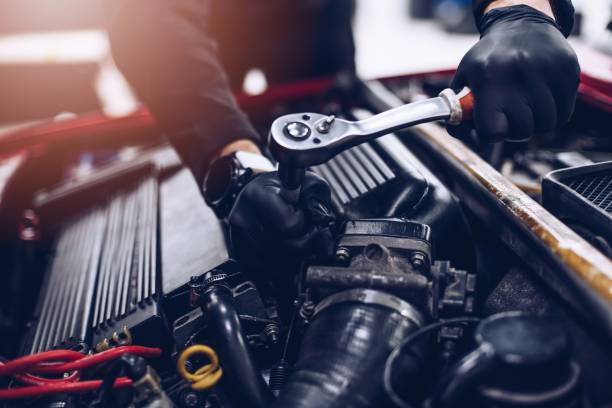 istock Mechanic in service repairing engine with wrench 1331850456