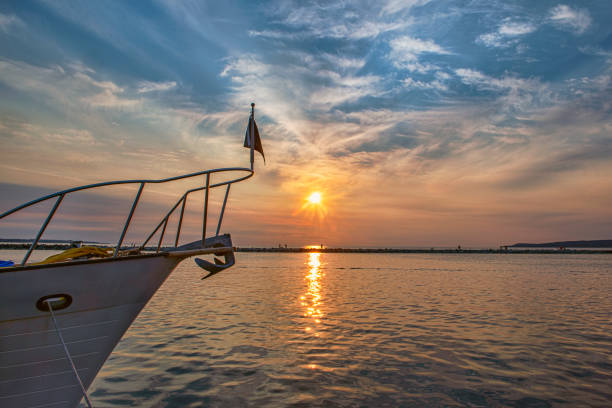 Boat Bow in near Silhouette at Sunset over Water