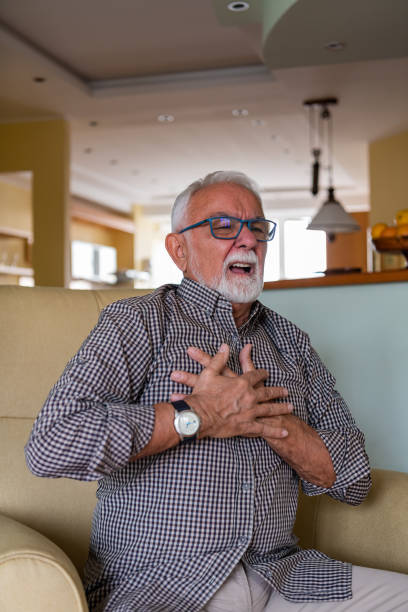 istock Lonely Older Man with Chronic Cardiovascular Problems is Desperate while Struggling with Insufferable Pain. 1331852896