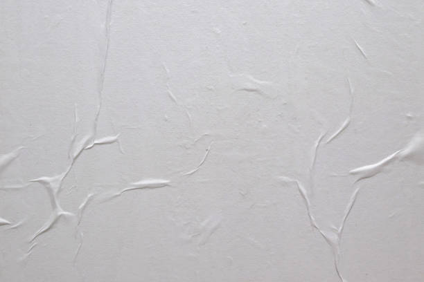 istock Blank white crumpled and creased paper poster texture background 1331856057