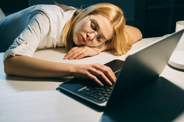 istock overwork fatigue deadline tired sleeping woman 1331856078
