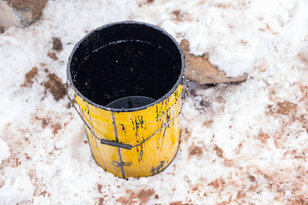 istock Empty bucket from under waterproofing compound against the background of snow 1331856225