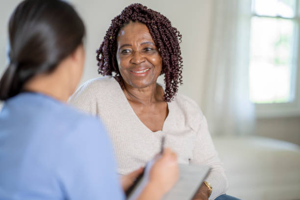 istock Nurse conducts home visit 1331856626
