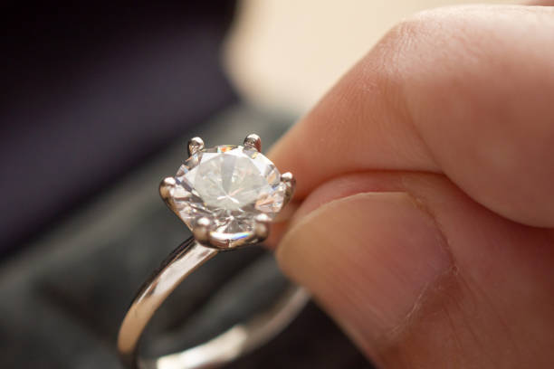 istock hand hold beautiful jewelry diamond ring 1331856658
