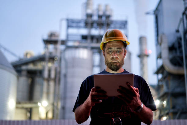 istock Engineer using digital tablet to expertise  industrial factory at night 1331856732