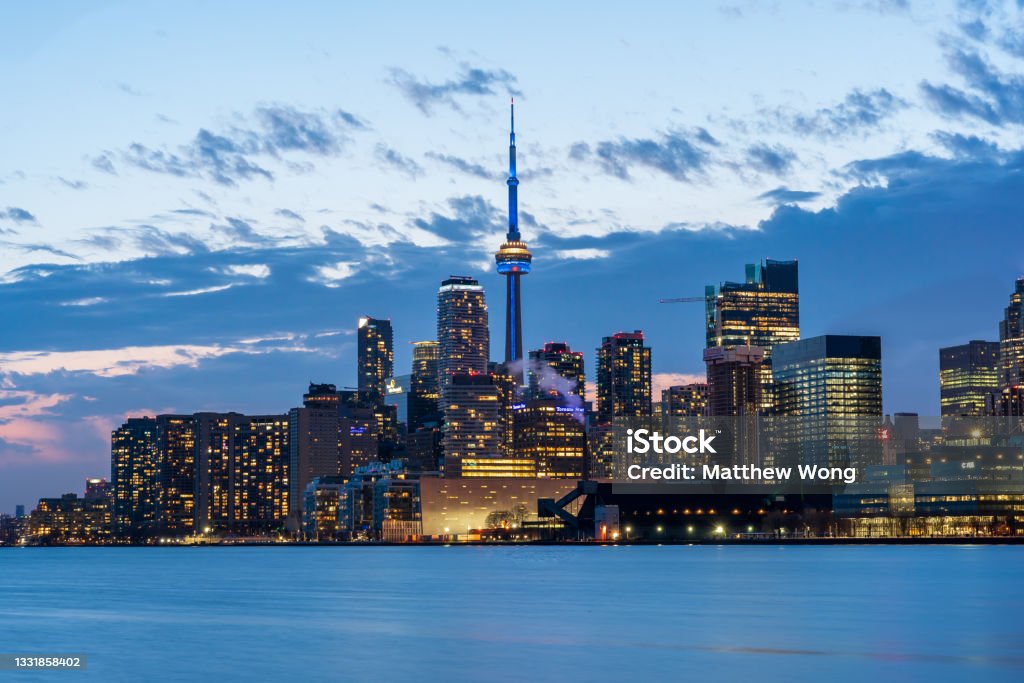 Toronto Skyline Dusk on a chilly spring night in Toronto from Polson Pier. Toronto Stock Photo