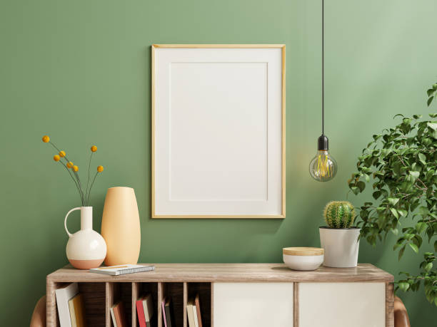 mockup foto cornice parete verde montata sull'armadio di legno con belle piante. - poster blank wall picture frame foto e immagini stock