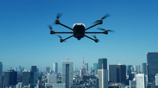 drohne fliegt über der modernen stadt. 3d-rendering. - drohne stock-fotos und bilder