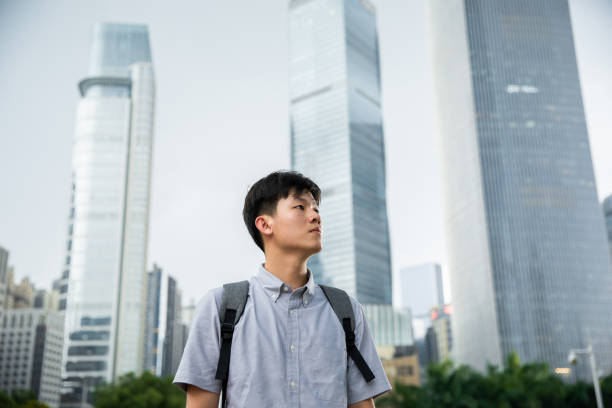 istock Young man looking at city 1331873756