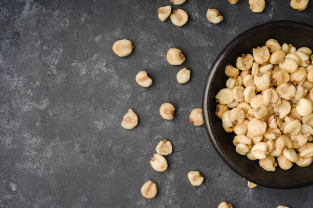 istock Half of a black plate with giant Peruvian corn and grains sprinkled around it. 1331875196