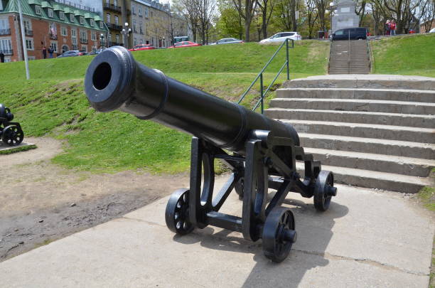 istock black iron cannon weapon and steps in Quebec Canada 1331883576