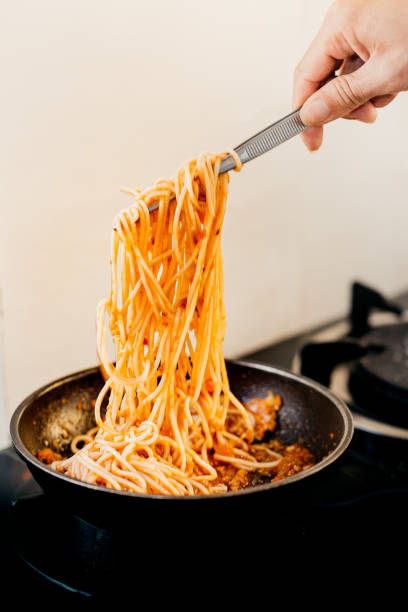 istock Tomato pasta is cooked in a frying pan on the kitchen background 1331885223