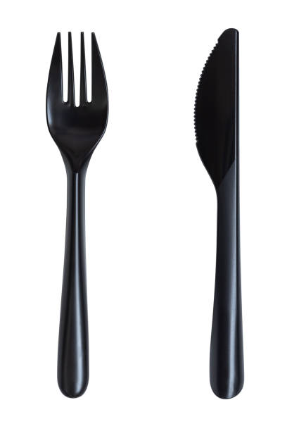 istock Black knife and fork plastic on white isolated on white background 1331887696