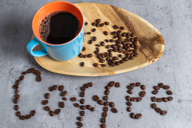 istock Black coffee served on a palm leaf plate. 1331889454
