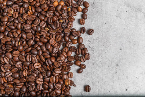 istock Background with roasted coffee beans on concrete background. 1331889565